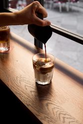 Faceless barista making cold brew coffee