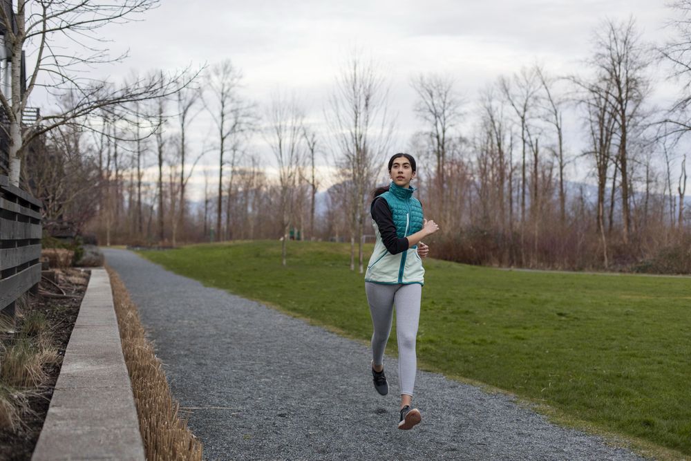 Young female running on a trail.