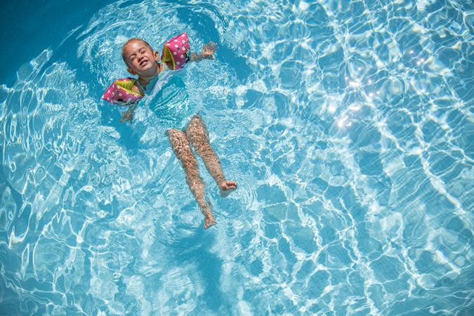 Girl leaning back in the water