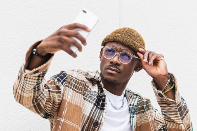 Stylish Black man taking selfie