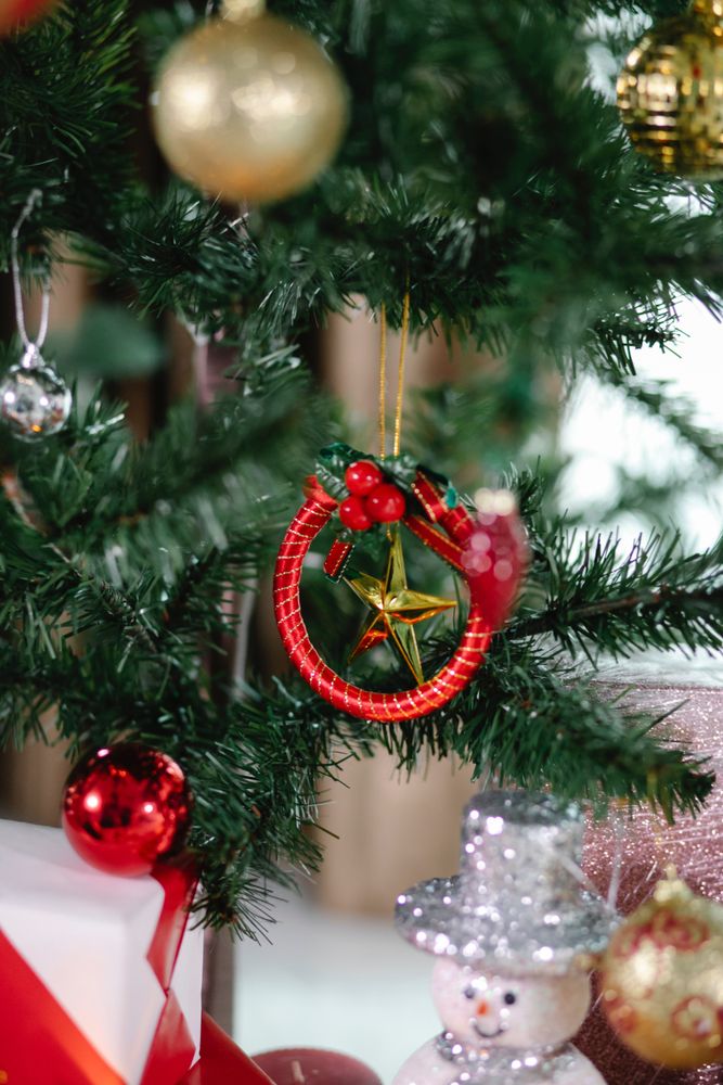 Special red bauble on Christmas tree