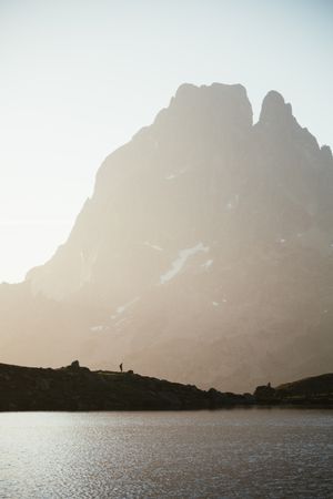 Majestic mountain landscape with human silhouette