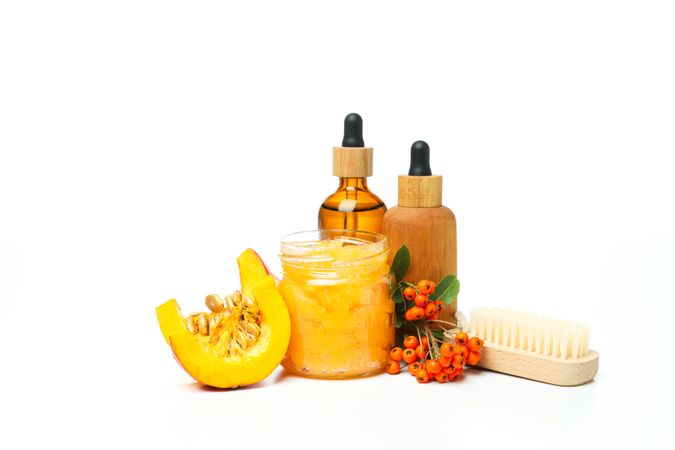 Skin care and body care concept - pumpkin cosmetic, isolated on light background