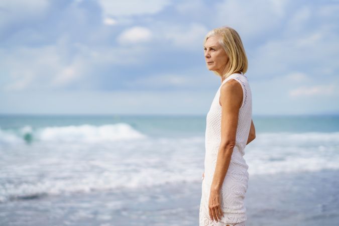 Side view of mature female looking out to the ocean