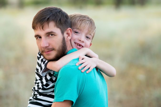 Affectionate father with son outdoor