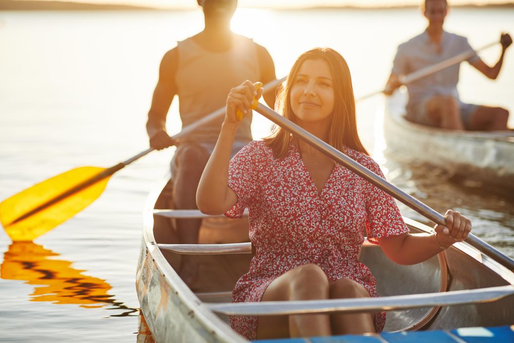 Contemplative woman rowing on a canoe