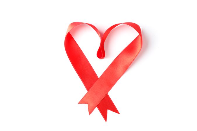 Red ribbon heart isolated on blank background