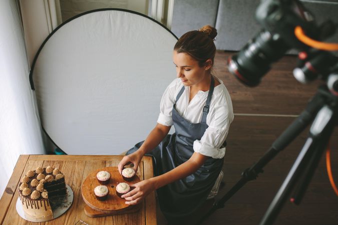 Female baker making a video of her preparing pastry items