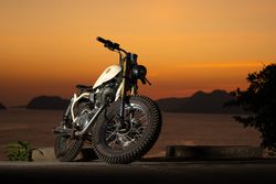 Motorbike near sea during sunset