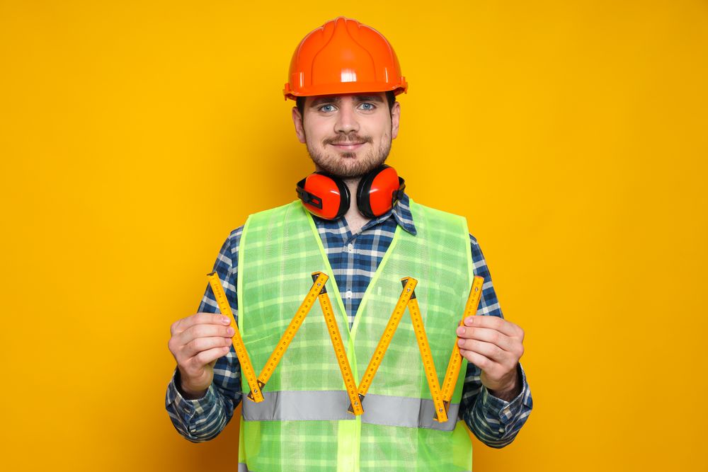Young man civil engineer in safety hat