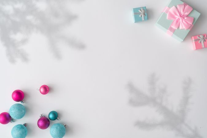 Christmas decorations, gifts with shadows on corners of light background