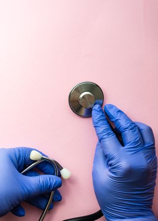 Looking down at pink table with stethoscope