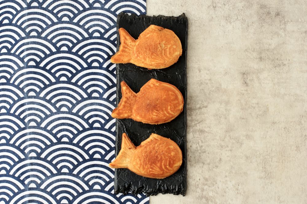 Three Japanese taiyaki waffles on rectangular plate
