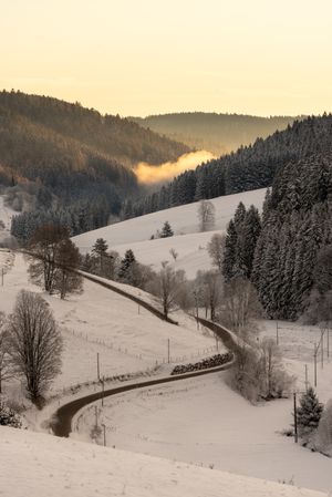 Deep snow in the  mountains at sunrise on a beautiful sunny day