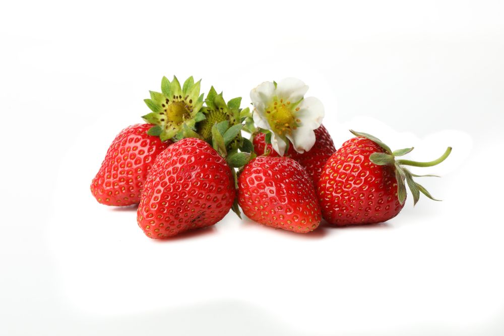 Tasty red strawberry isolated on plain background. Summer berry