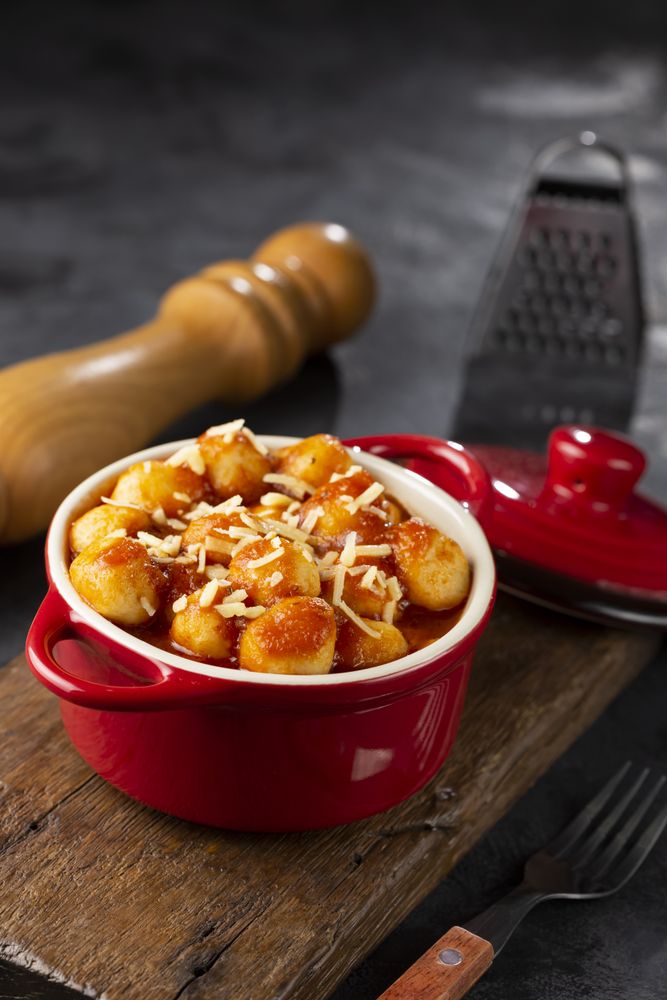 Gnocchi with tomato sauce and grated Parmesan cheese.