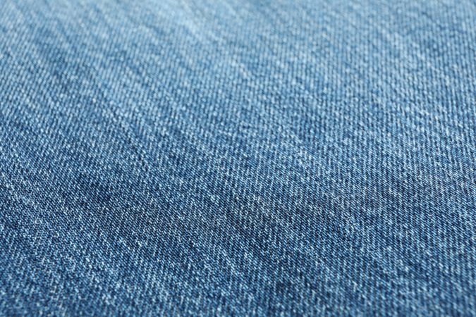 Texture of blue jeans as background, space for text