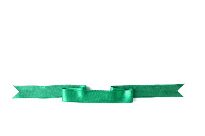 Green ribbon isolated on blank background. Gift concept