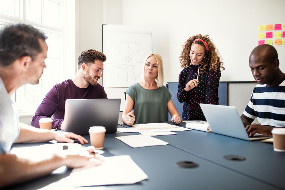 Group of people working around an table