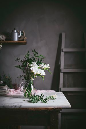 Bunch of fresh white flowers in glass vase