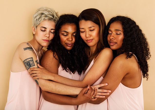 Group of multi-ethnic female friends in studio together