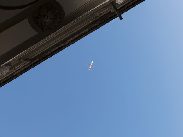 Plane at cruising altitude against blue sky