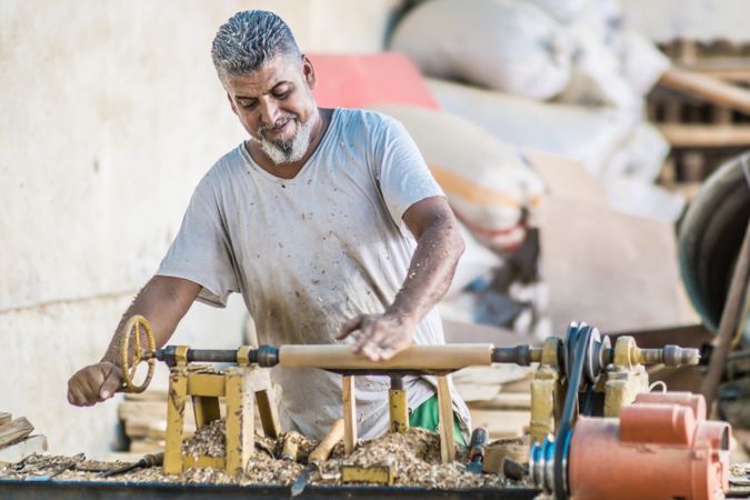 Man using woodworking machine at workplace
