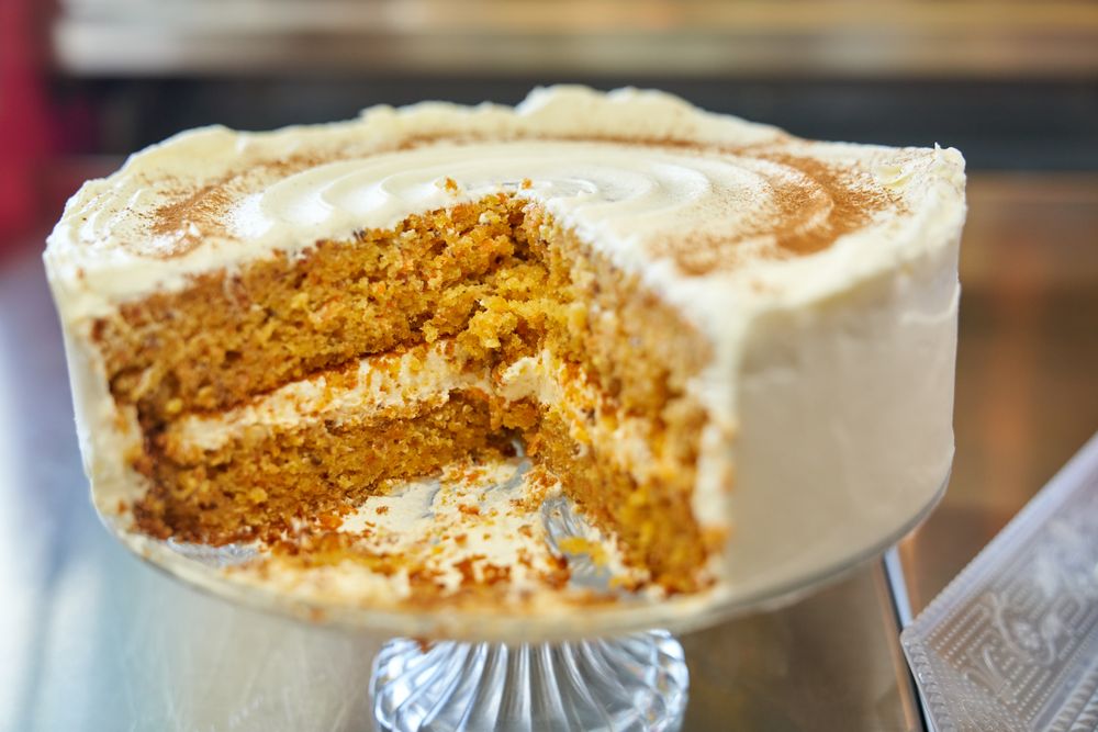 Sliced cake placed on glassware on table