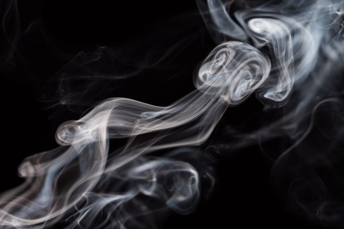 Abstract smoke moving on dark background