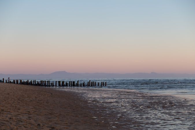 Calm sea on background of pink sky