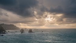 Beautiful bay around rocks and cloudy sunset
