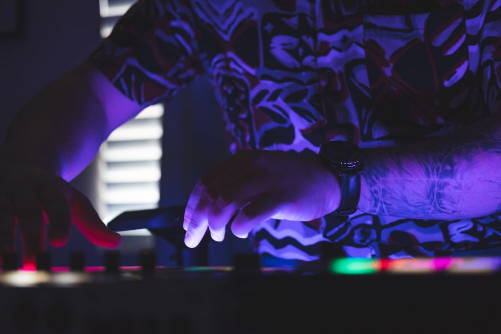 Man playing music on mixer