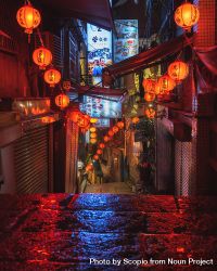 Red lit lanterns decorating the alley at night 5RJ6B5