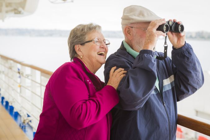 Mature Couple Enjoying The Deck of a Cruise Ship