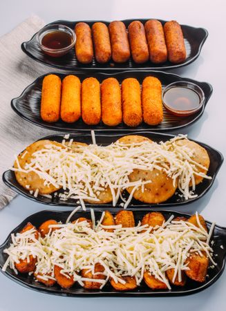 Combinations of Venezuelan dishes, served as starters, tequeños, sweet arepas with cheese and fried plantain with cheese