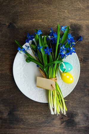 Easter table setting with scilla flowers with decorative eggs