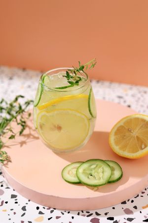 Infused iced water with lemon and cucumber garnish