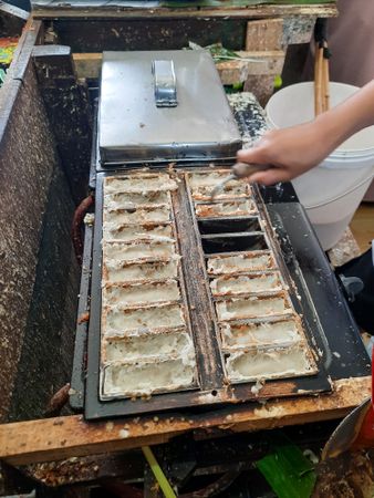 The making of Pancong cake, a traditional snacks in Indonesia  made from a mixture of rice flour, grated coconut, and coconut milk.