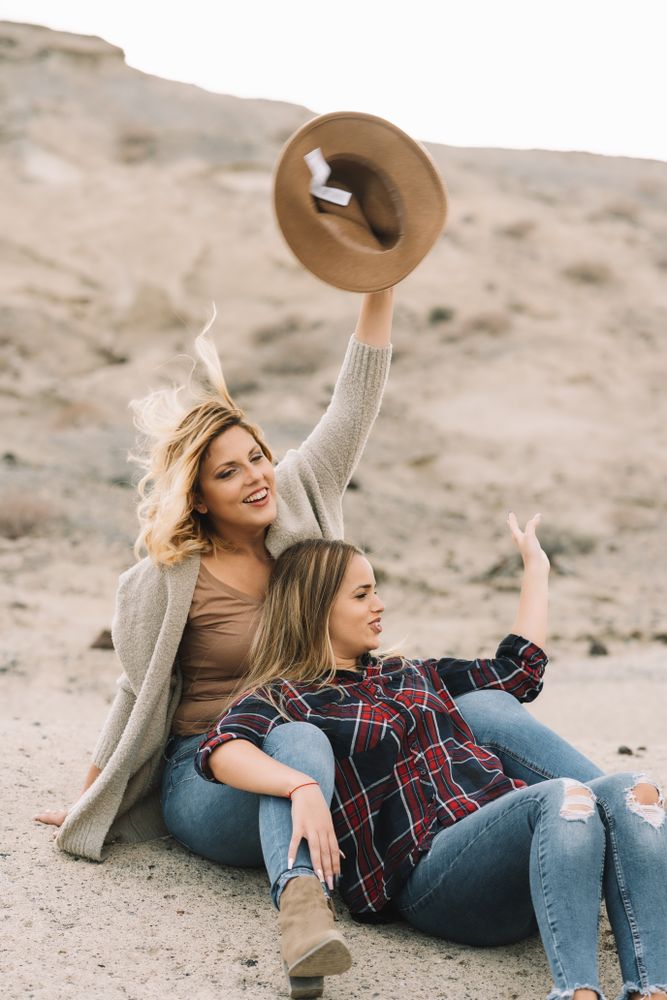 Content blond women cuddling on nature