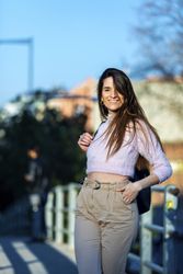 Woman in casual wear outside in the city on a sunny day