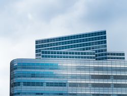 Contemporary glass skyscraper in cityscape
