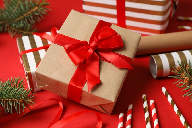 Composition with Christmas accessories on red background, closeup