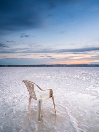 Chair on salt mine during sunset