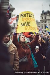 London, England, United Kingdom - March 5 2022: Woman with “Protect Ukraine Save Europe” sign 0vnkZ0