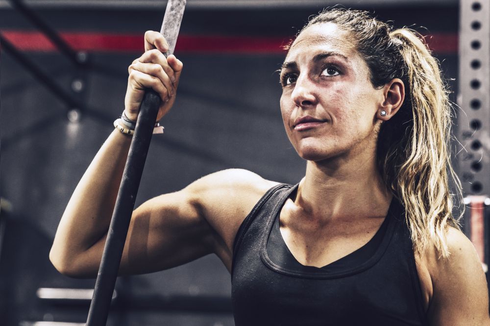 Serene woman relaxing in gym