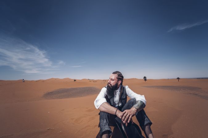 cowboy sitting in desert