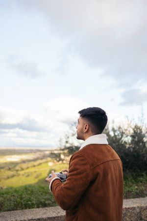 Young man flying drone