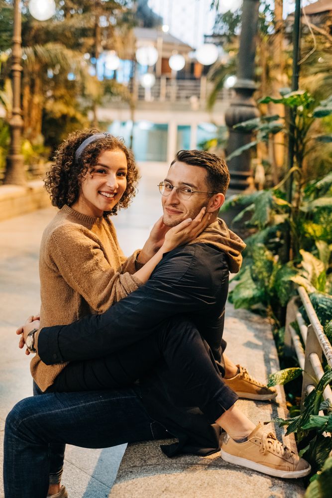 Young couple embracing on bench
