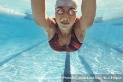 Underwater shot of female swimmer swimming inside pool 41aWO4