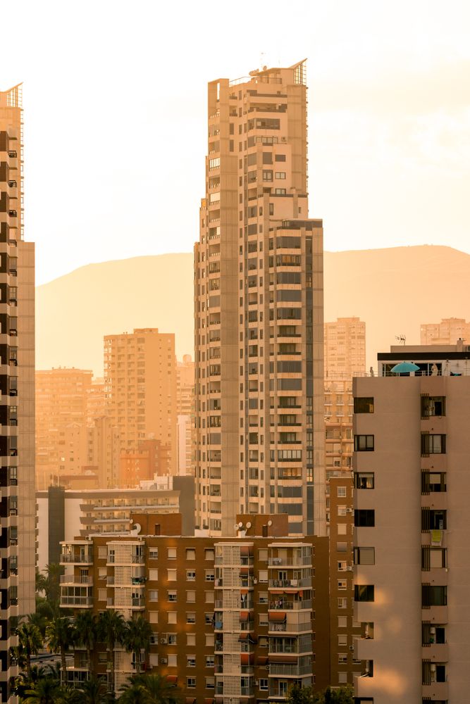 Residential buildings against sunset sky